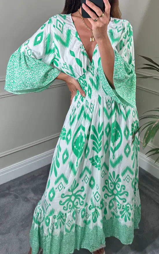 Vestido largo con escote en V y estampado floral en azul y blanco