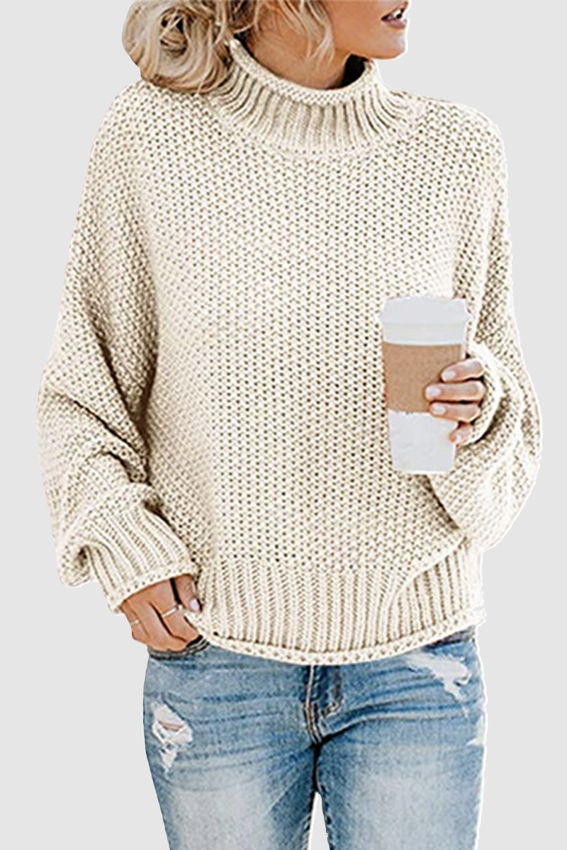 Acogedor jersey con interesante patchwork y cuello alto