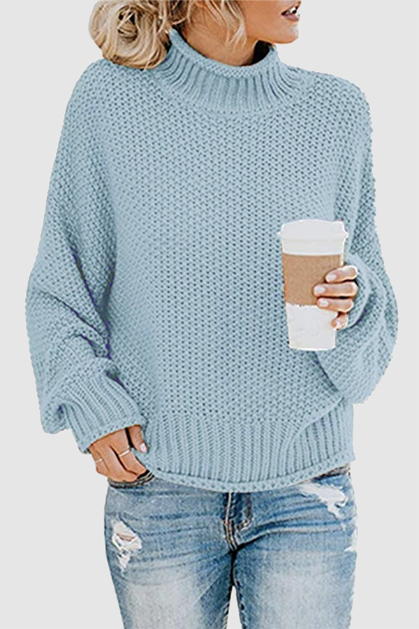 Acogedor jersey con interesante patchwork y cuello alto