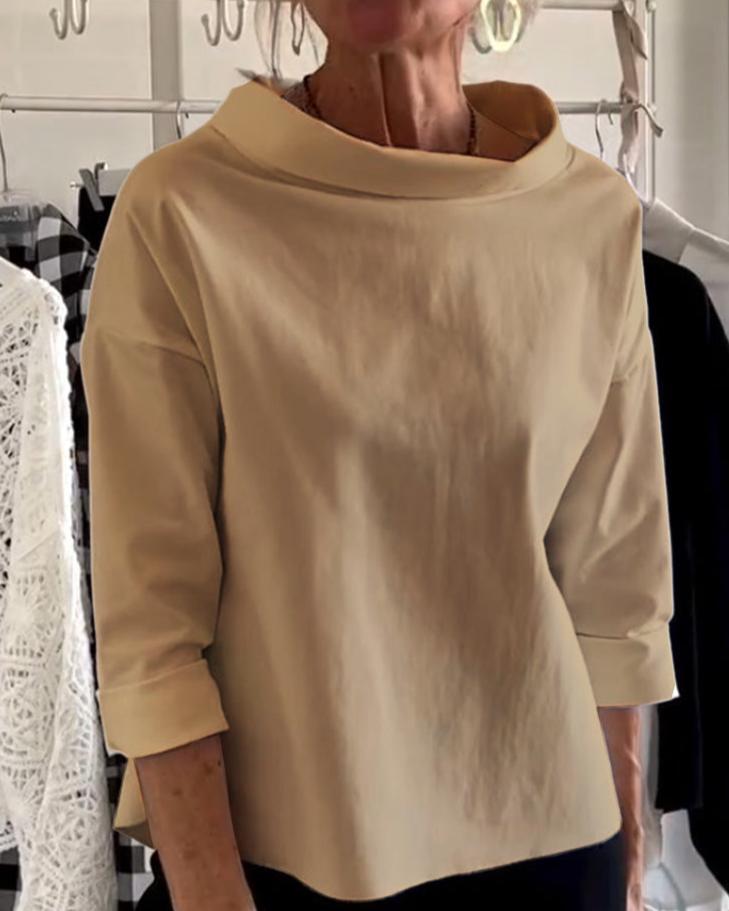 Elegante top con cuello alto para mujer