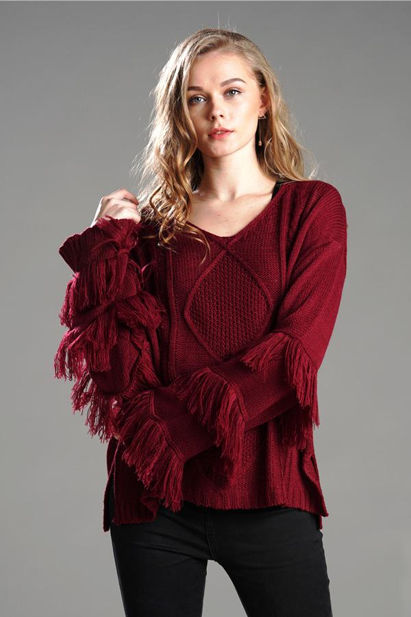 Jersey mullido con borlas para mujer