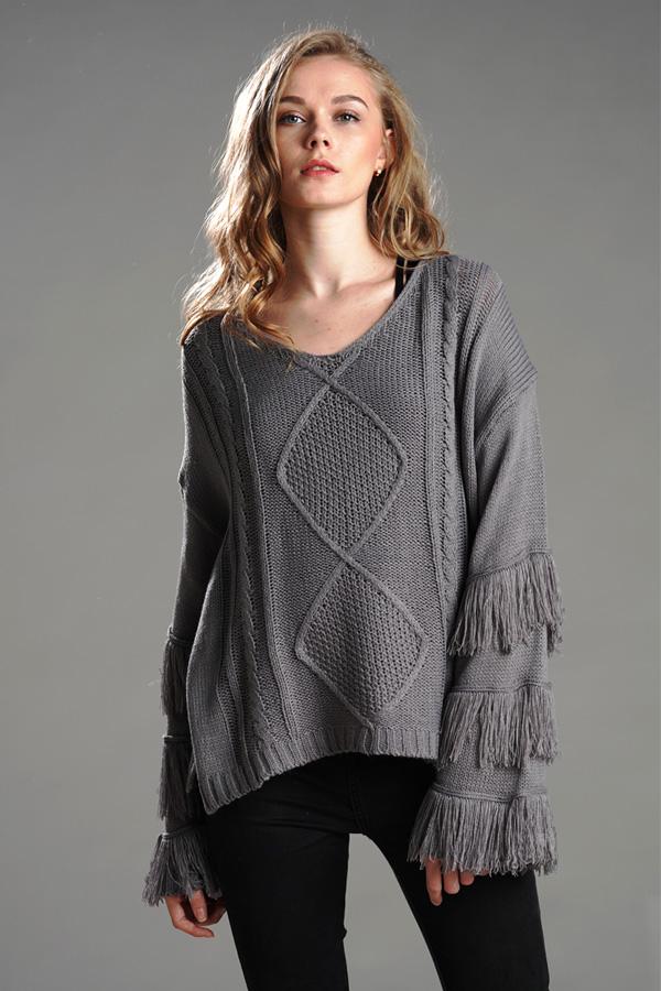 Jersey mullido con borlas para mujer