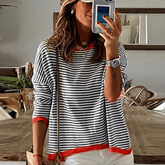 Inès lavigne | jersey de rayas azules con ribete naranja