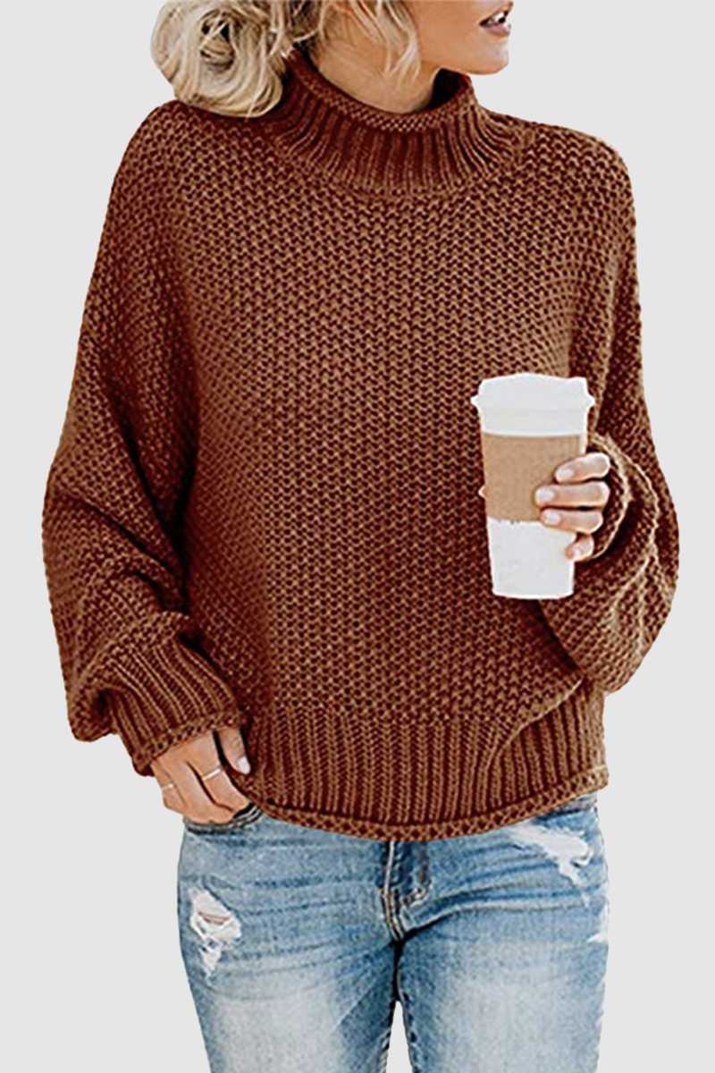 Acogedor jersey con interesante patchwork y cuello alto