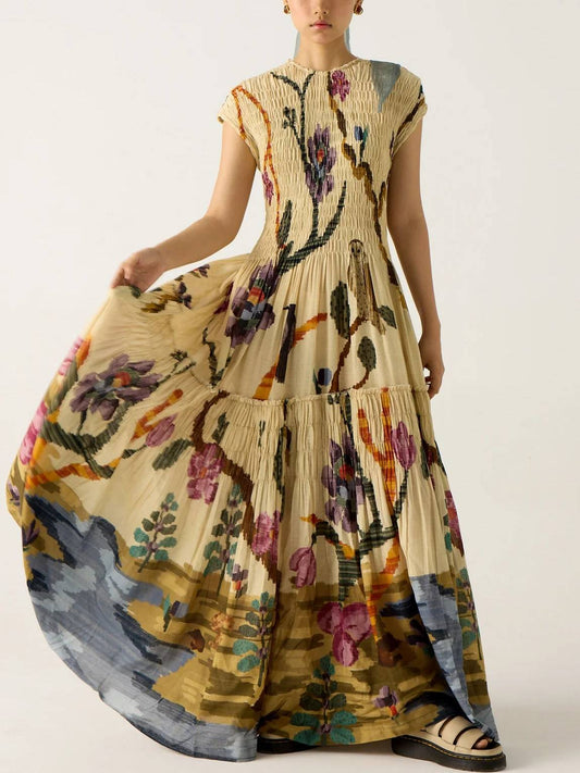 Vestido largo fluido con estampado artístico y manga corta
