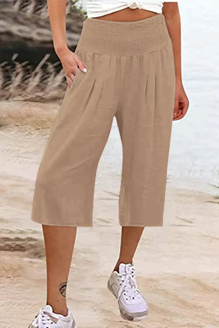 pantalón liso monocolor con cintura alta y perneras anchas, largo medio
