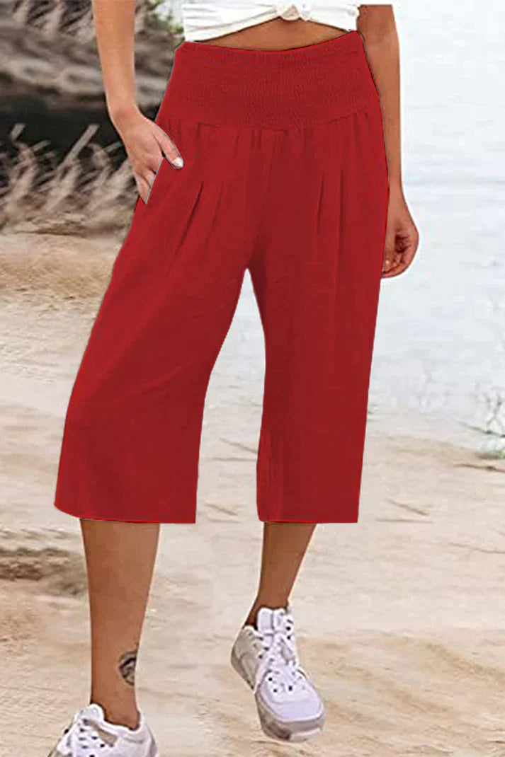 pantalón liso monocolor con cintura alta y perneras anchas, largo medio