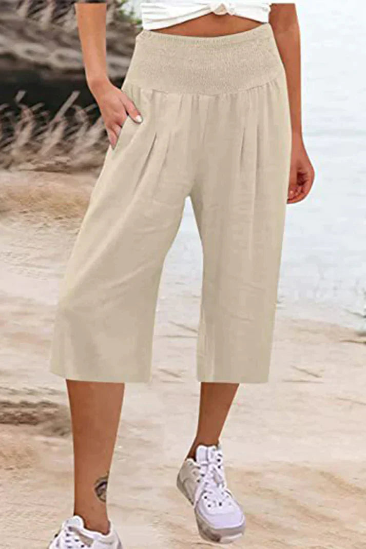 pantalón liso monocolor con cintura alta y perneras anchas, largo medio