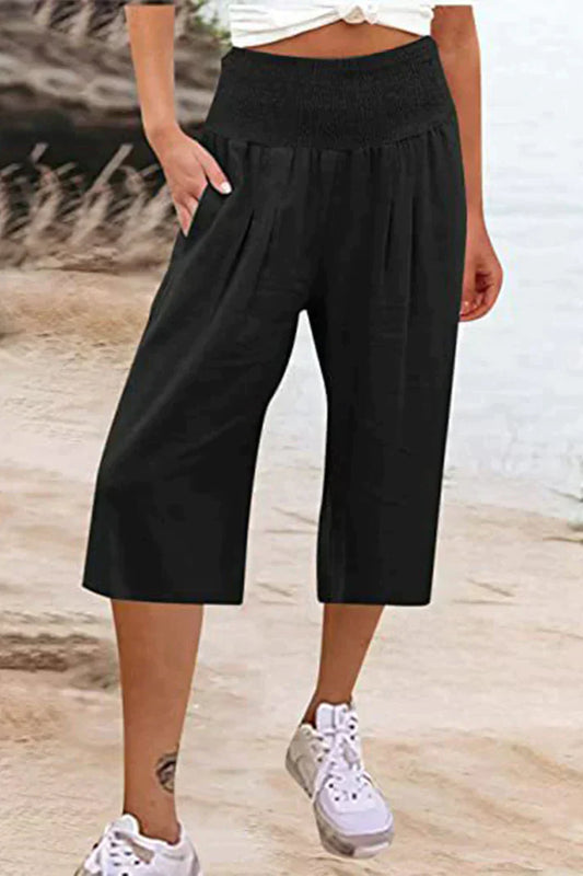 pantalón liso monocolor con cintura alta y perneras anchas, largo medio