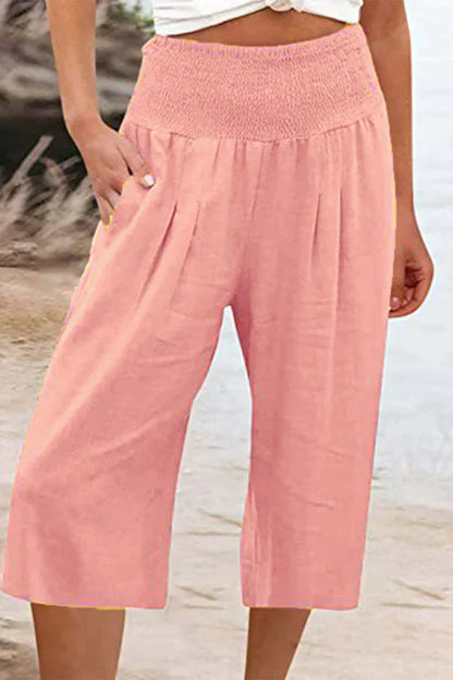 pantalón liso monocolor con cintura alta y perneras anchas, largo medio