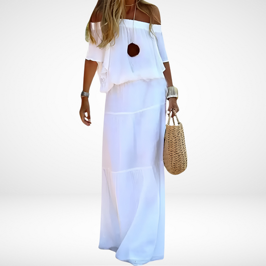 Elegante maxi vestido blanco sin hombros para la playa