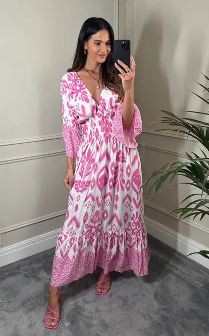 Vestido largo con escote en V y estampado floral en azul y blanco