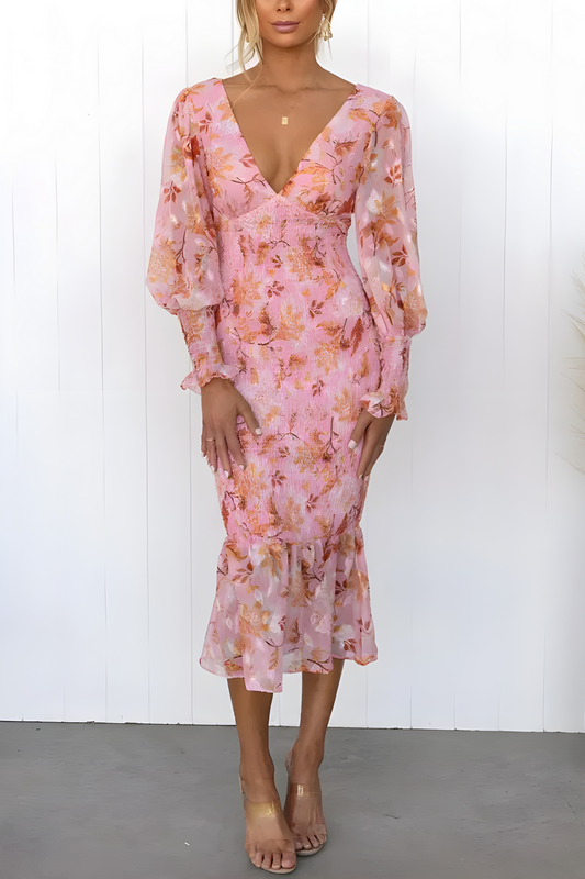 Vestido midi fluido con mangas largas y un sutil estampado floral para un look elegante
