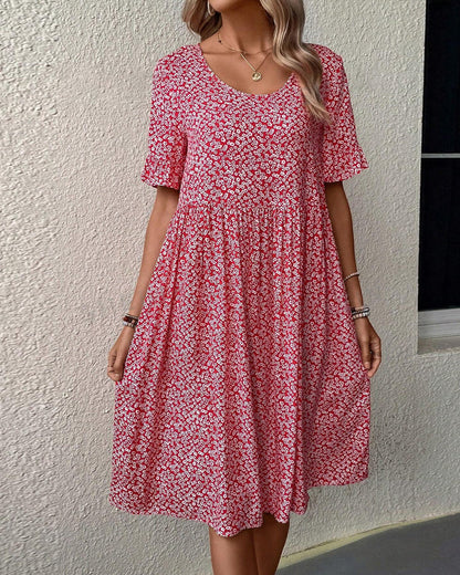 Elegante vestido corto de manga corta con delicado estampado floral