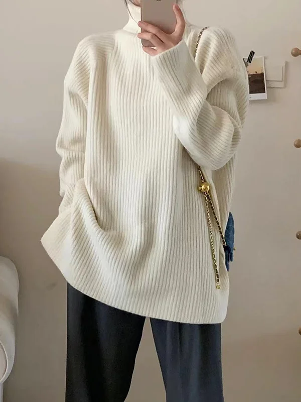Elegante jersey de manga larga y aberturas laterales