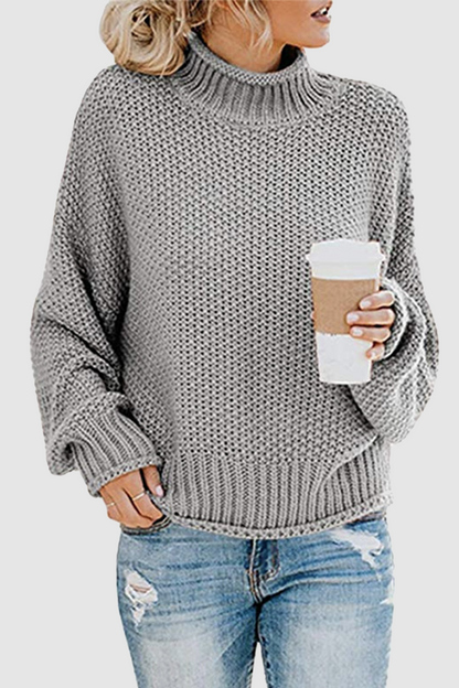 Acogedor jersey con interesante patchwork y cuello alto