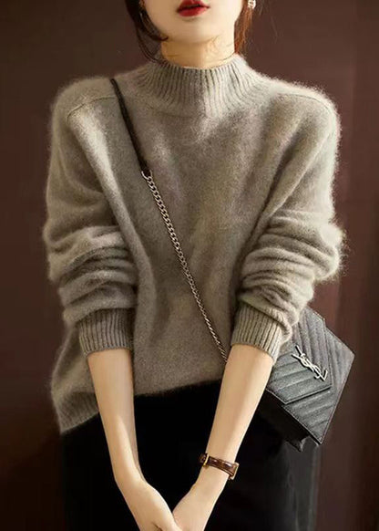 Elegante jersey patchwork con cuello alto para el frío