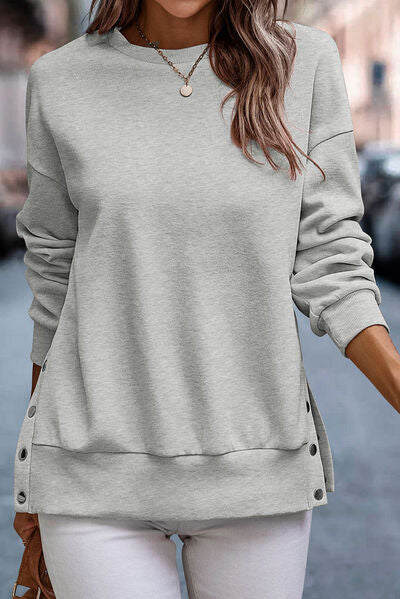 Jersey de cuello redondo con detalle de botones automáticos
