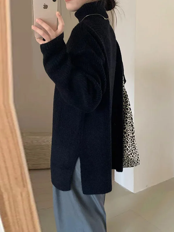 Elegante jersey de manga larga y aberturas laterales