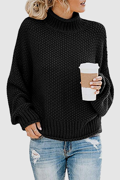Acogedor jersey con interesante patchwork y cuello alto