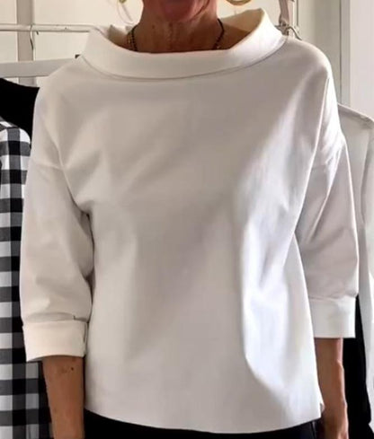 Elegante top con cuello alto para mujer
