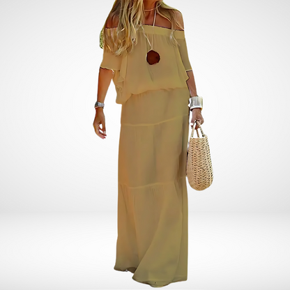 Elegante maxi vestido blanco sin hombros para la playa