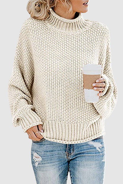 Acogedor jersey con interesante patchwork y cuello alto