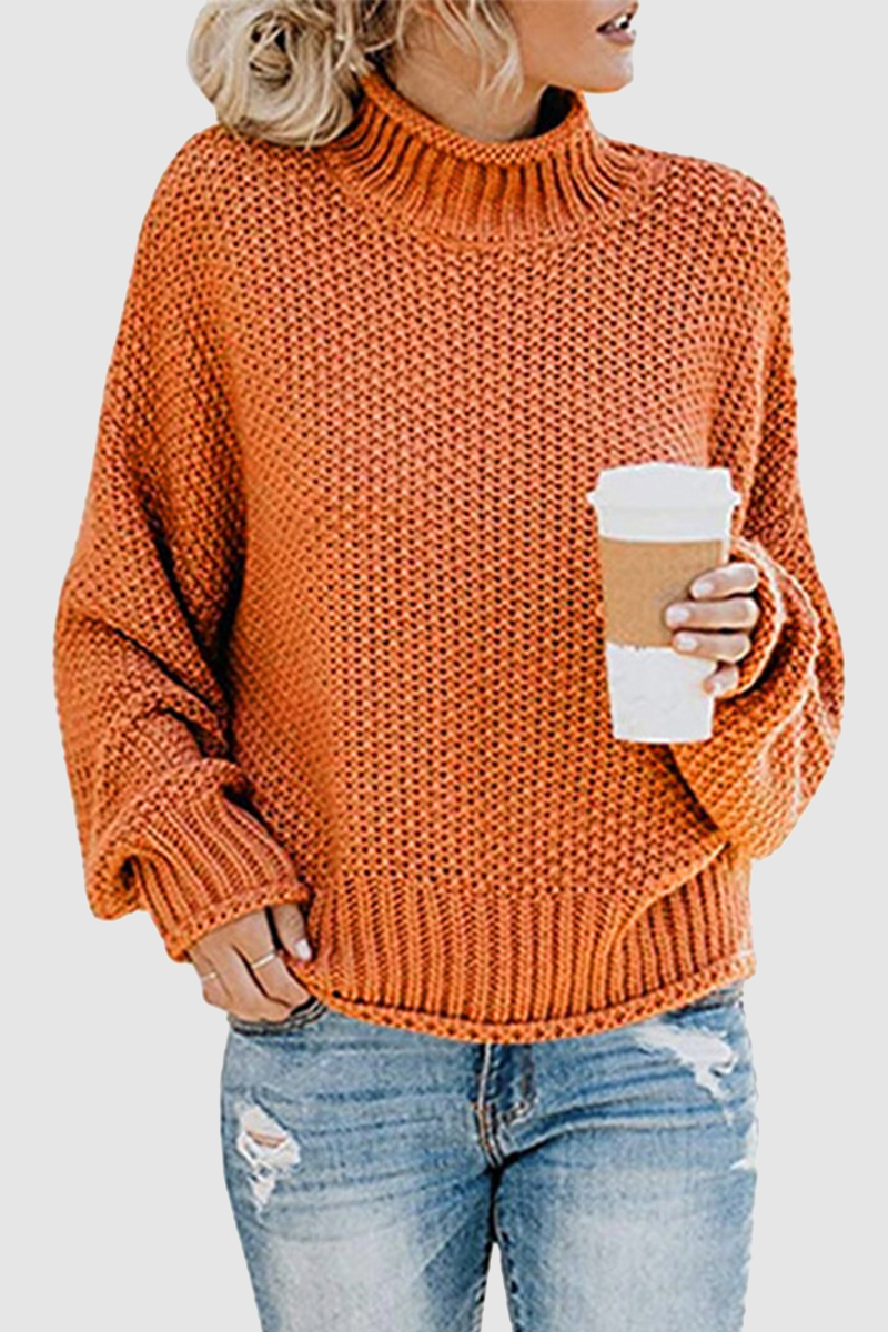 Acogedor jersey con interesante patchwork y cuello alto