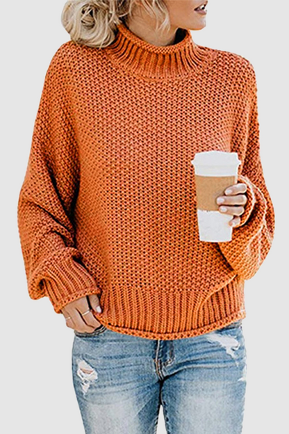 Acogedor jersey con interesante patchwork y cuello alto