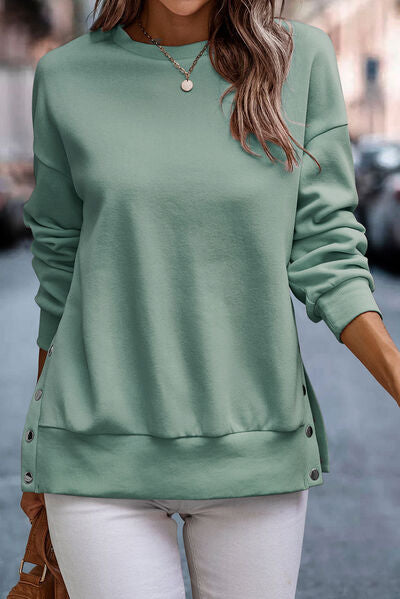 Jersey de cuello redondo con detalle de botones automáticos
