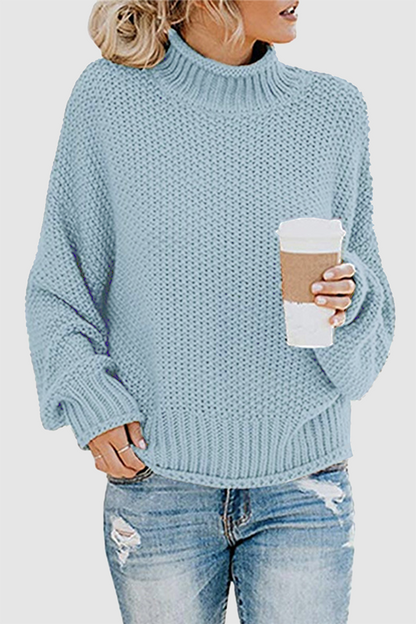 Acogedor jersey con interesante patchwork y cuello alto