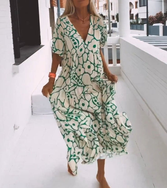 Elegante vestido midi con cuello en V y suave estampado