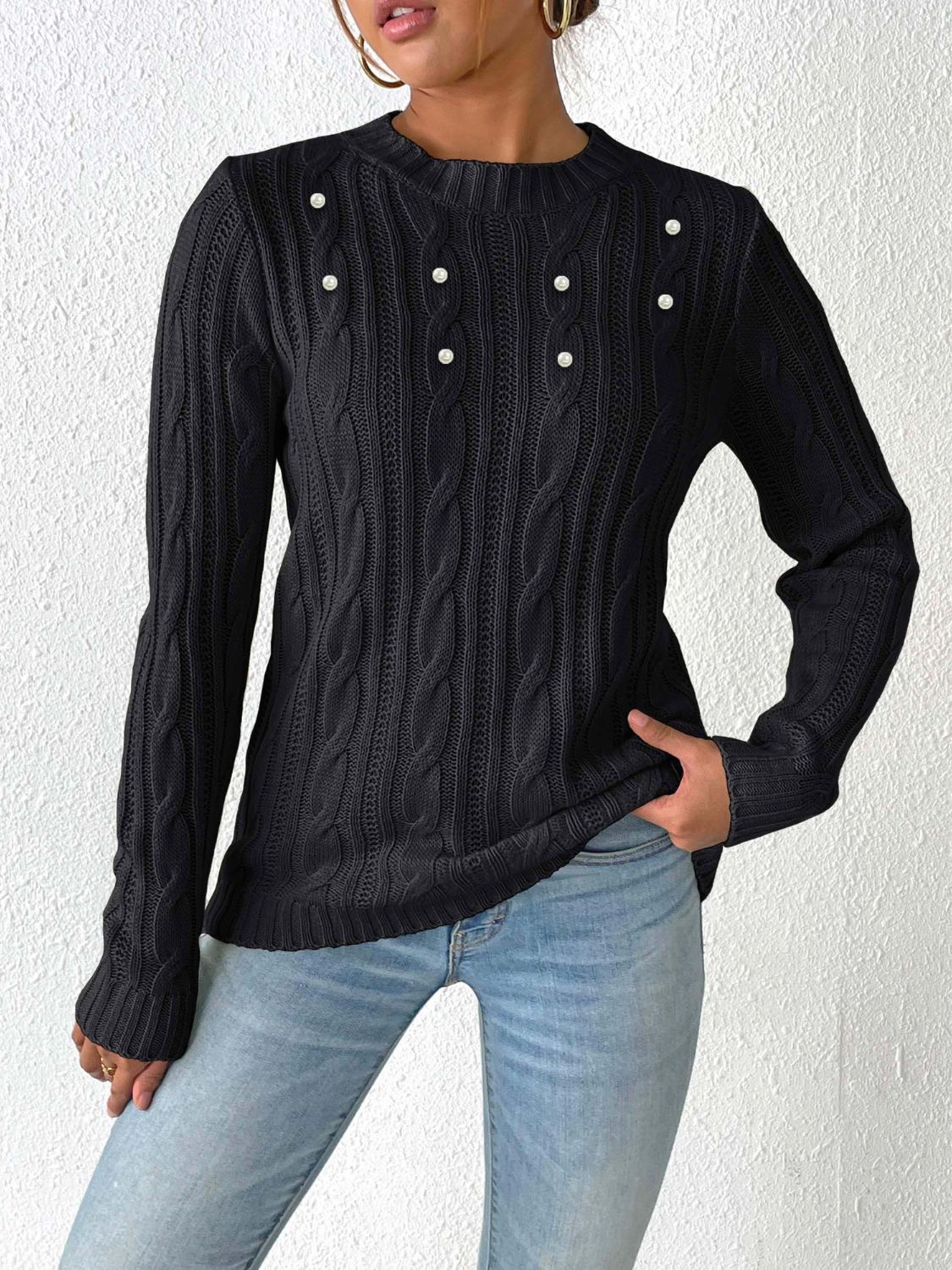 Elegante jersey con estampado tejido y delicados detalles de perlas