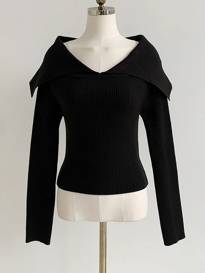 Elegante jersey con efecto de hombros al aire