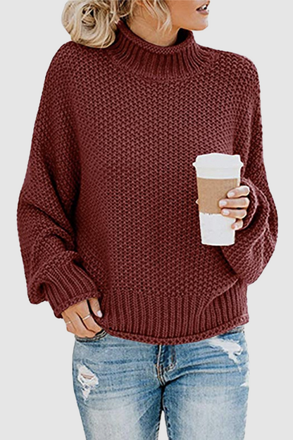 Acogedor jersey con interesante patchwork y cuello alto