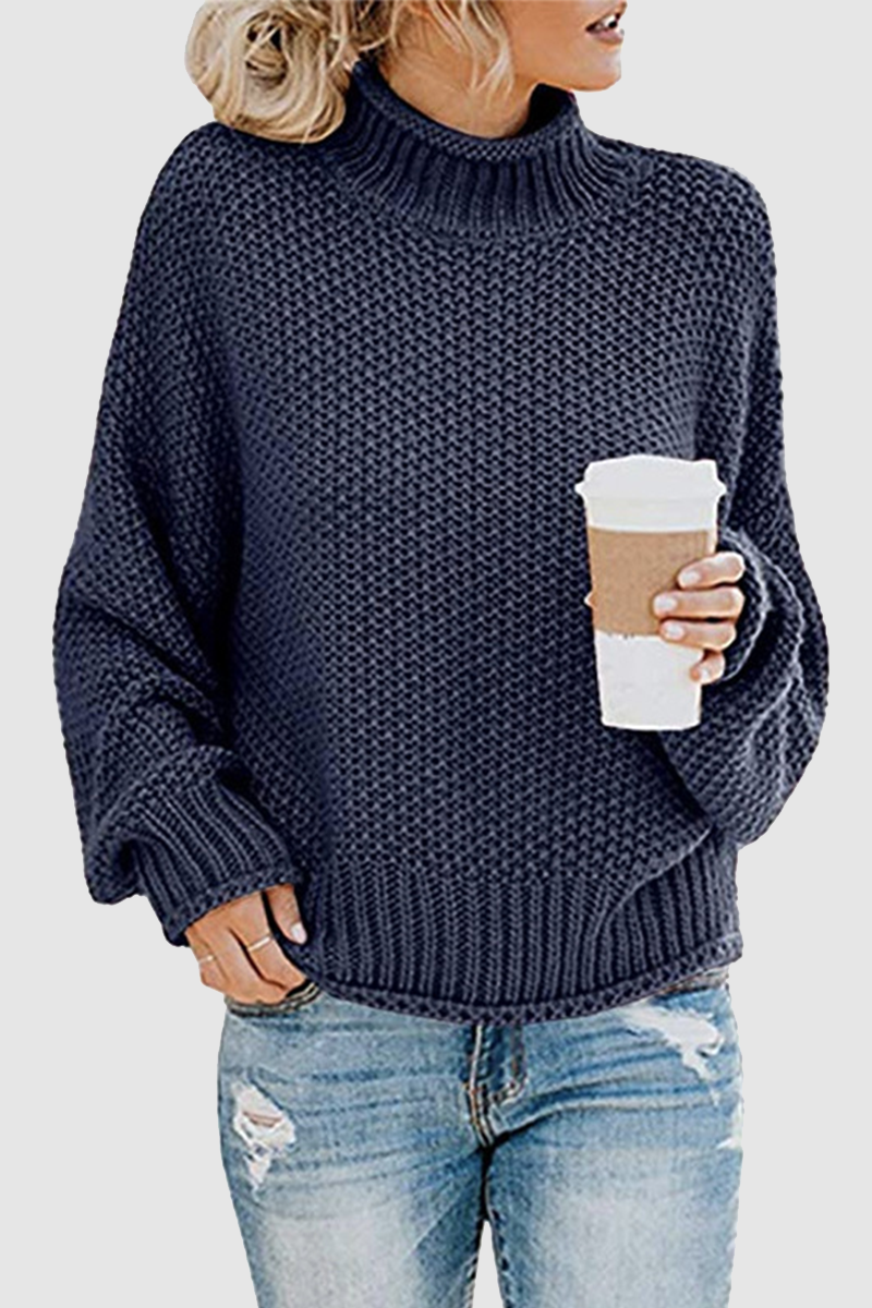 Acogedor jersey con interesante patchwork y cuello alto