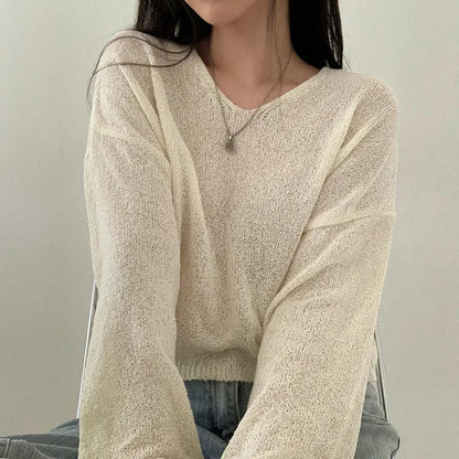 Top suelto de manga larga para mujer