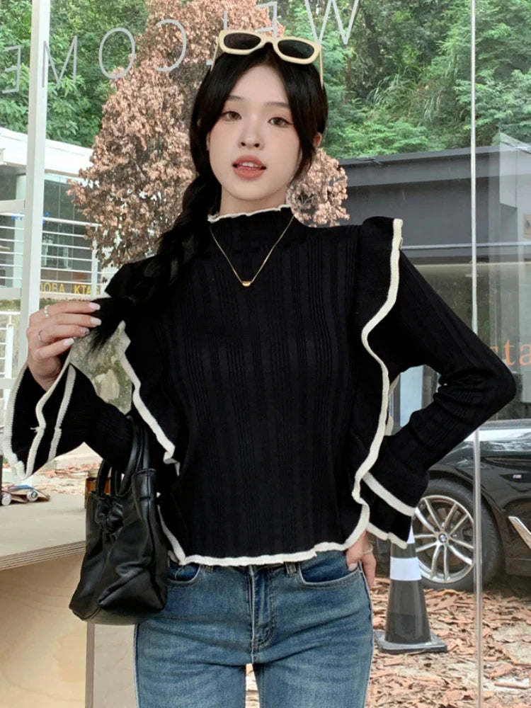 Qarina Sweater | Elegante jersey con volantes