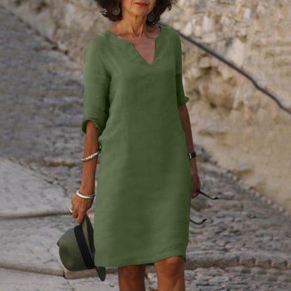 Elegante vestido clásico hasta la rodilla con mangas tres cuartos