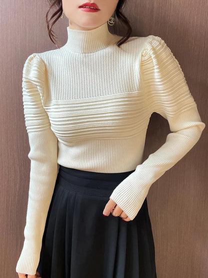 Mona | Jersey de punto de cuello alto con mangas abullonadas para mujer