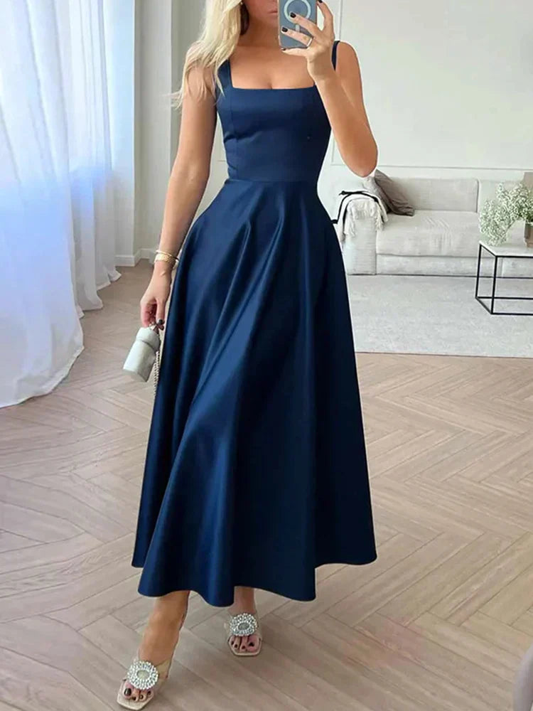 Vestido de noche midi con tirantes y falda amplia y elegante