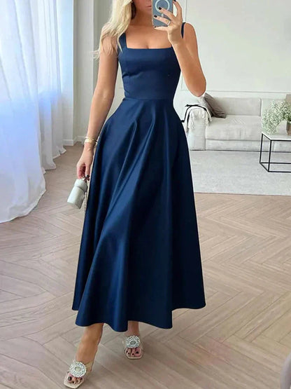 Vestido de noche midi con tirantes y falda amplia y elegante