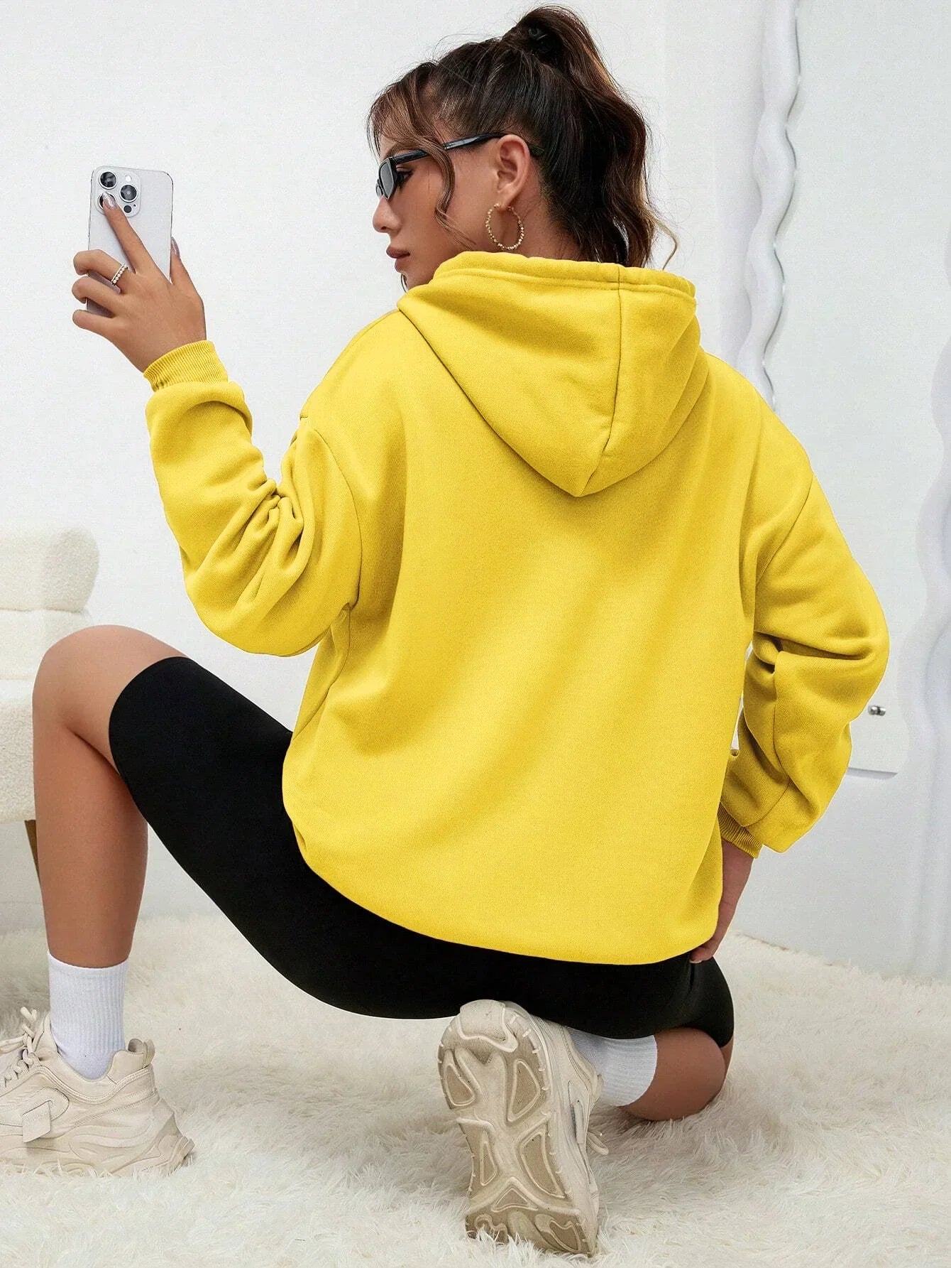 Dorte | Sudadera holgada con capucha y bolsillo para mujer