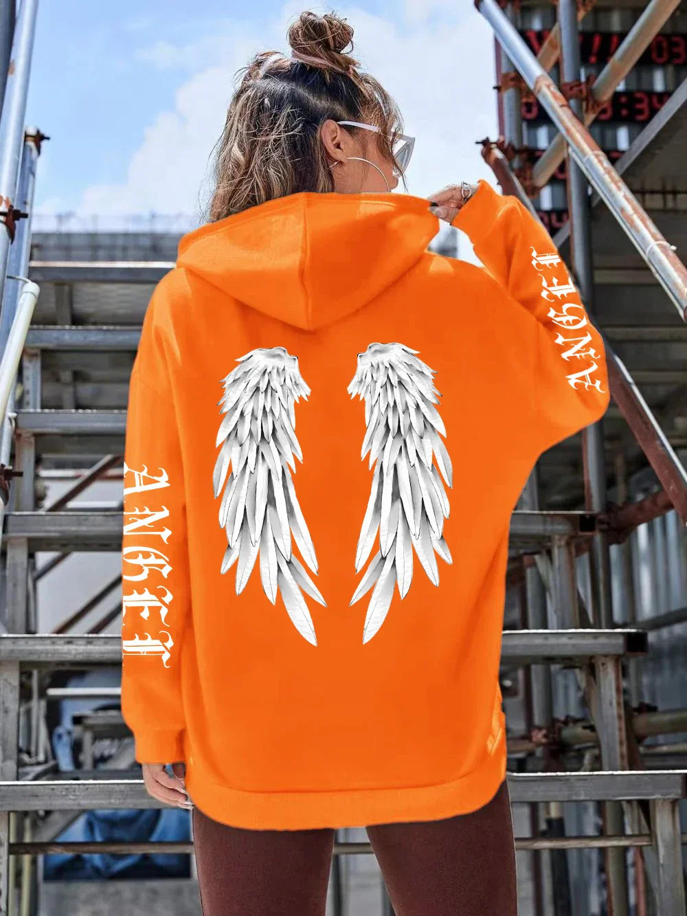 Heidi | Sudadera holgada con capucha y estampado de alas para mujer