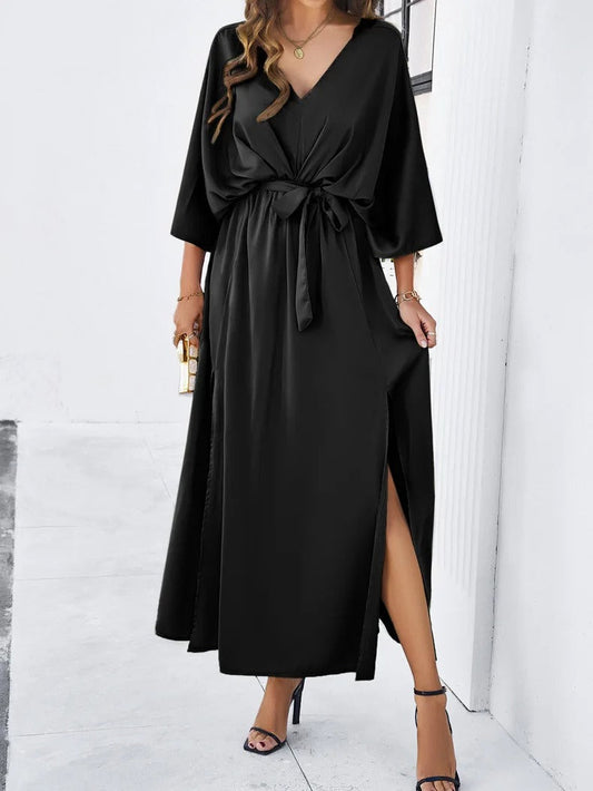 Elegante vestido largo con mangas murciélago y cinturón