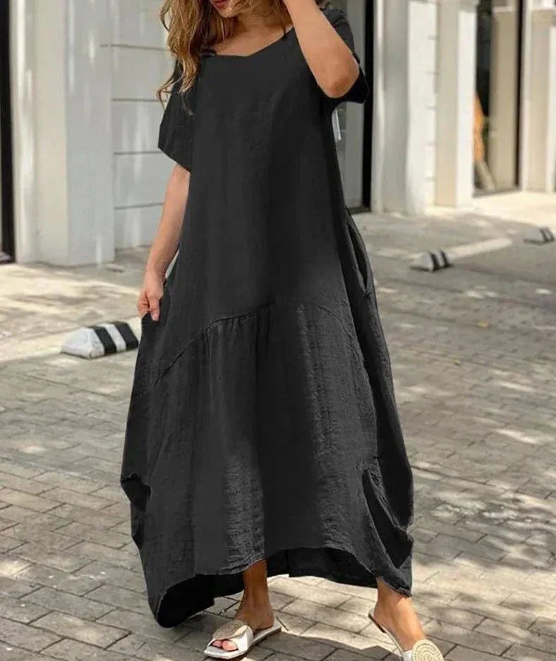 maxi vestido acampanado de mujer con cuello en V y mangas cortas