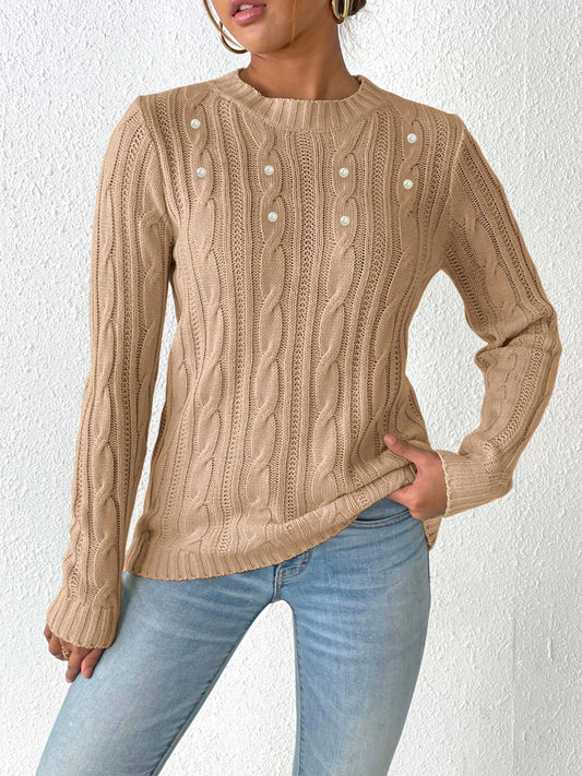 Elegante jersey con estampado tejido y delicados detalles de perlas
