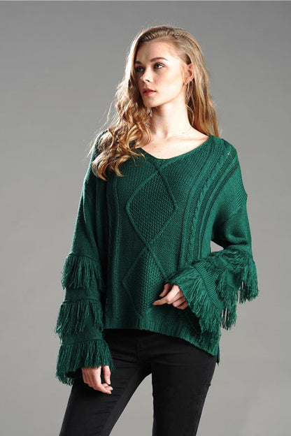 Jersey mullido con borlas para mujer