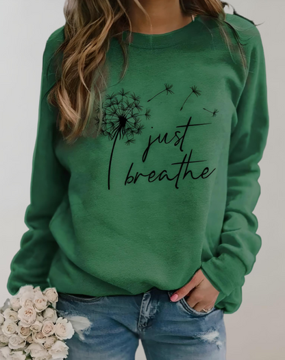 Sara | Jersey oversize de cuello redondo con inscripción "Just Breath