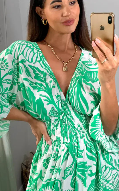 Vestido largo con escote en V y estampado floral en azul y blanco